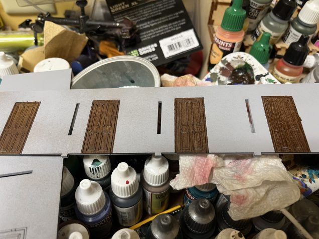 Here are the doors after I painted them and removed the tape. I removed the tape immediately after painting the doors while the paint was still drying.  