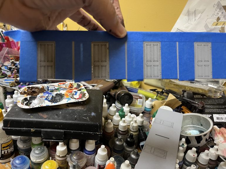 I masked the interior doors with low adhesive tape and then painted the doors.