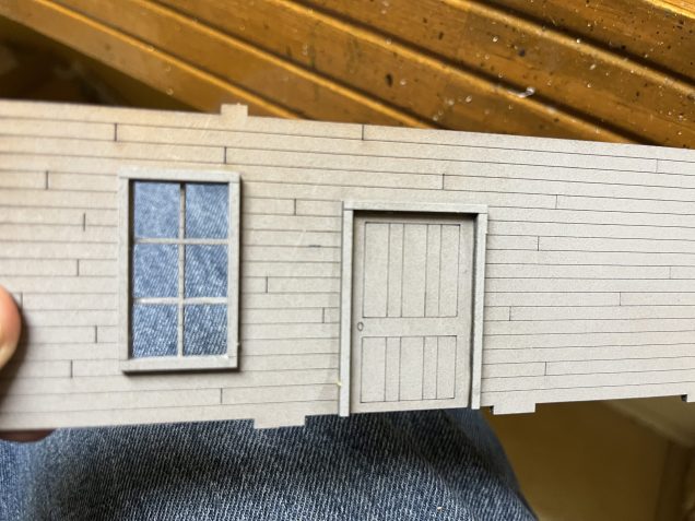 One window and the rear door with frames glued in place.