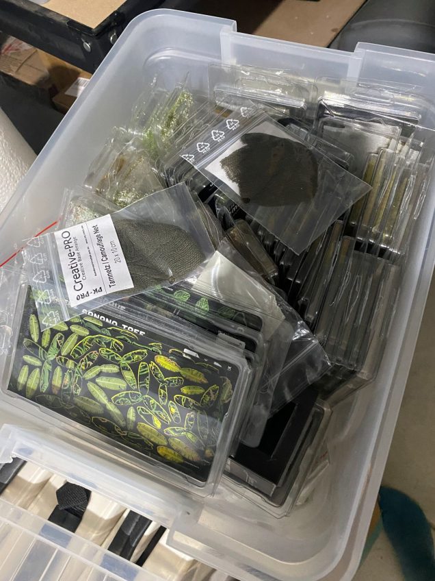 Large tub of grass tufts and similar.