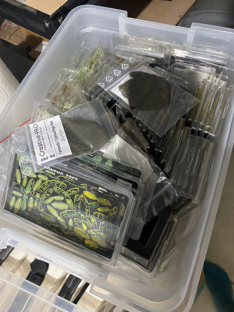 Large tub of grass tufts and similar.