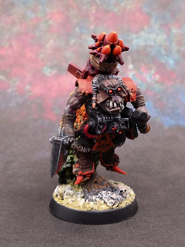 I decided to do more on the boots. There was too much plain black on the model. I mixed black and the screaming pink and gave it a pink and red highlight.