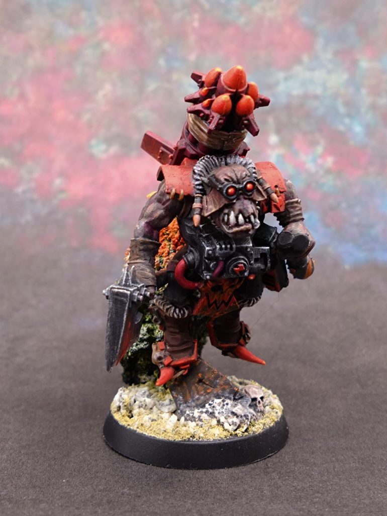 I decided to do more on the boots. There was too much plain black on the model. I mixed black and the screaming pink and gave it a pink and red highlight.