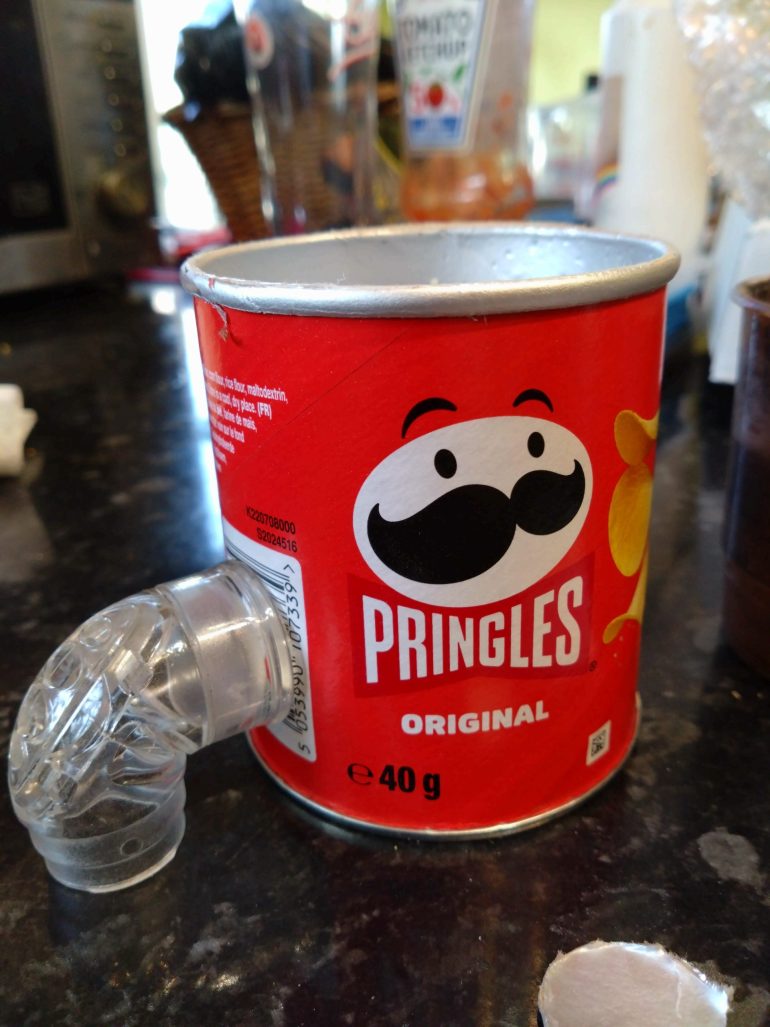 My sleep apnea mask broke. The hose connector to the mask has a sci-fi look to me. Plugged into a Pringle tube it looks kinda fun.