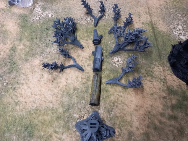 My jungle trees from David Sheff models are printed in clip together pieces so you can make them as tall or as short as you like with different branches or stumps. My taller trees are 16 inches high which makes them the tallest trees own. Bit of a task to paint each leaf. I could print out more to make a dense table but they might be hard to play around