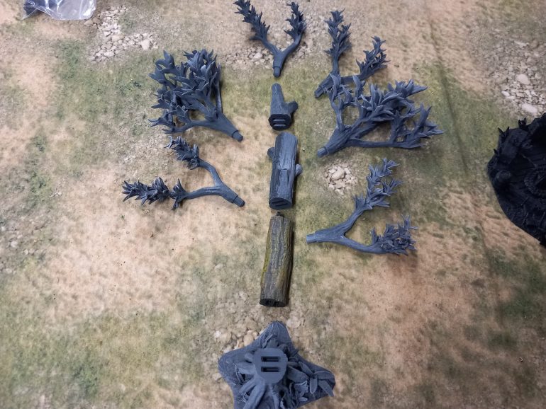 My jungle trees from David Sheff models are printed in clip together pieces so you can make them as tall or as short as you like with different branches or stumps. My taller trees are 16 inches high which makes them the tallest trees own. Bit of a task to paint each leaf. I could print out more to make a dense table but they might be hard to play around