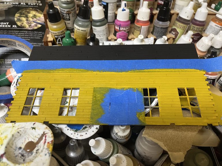 Painting yellow over a grey primer will require multiple coats. This is after the first coat.