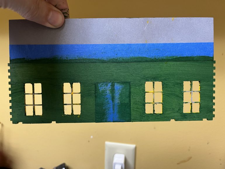 Upper floor interior. The area that’s above the masking tape is the back of the sign and will be painted as natural wood.