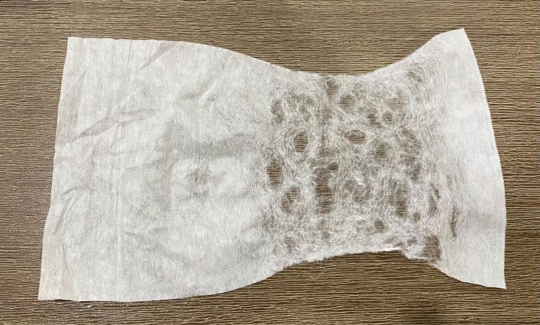 I teased the baby wipe apart by pulling on it gently.  The more holes you create when doing this the less 'veins' will be created with the finished effect.