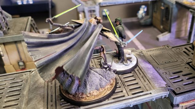 Thinking he was safe from Grievous, who had just activated, General Veers moved to the center of the board to take control of an objective. Alas, Grievous was able to activate again thanks to a Shatterpoint card, and delivered a devastating melee attack that left Veers wounded. It wasn't a fair fight at all -- Veers has low hit points and most of his abilities involve moving his troops around, whereas Grievous is a gigantic cyborg with four spinning lightsabers for arms...