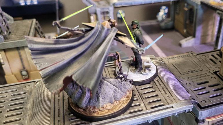 Thinking he was safe from Grievous, who had just activated, General Veers moved to the center of the board to take control of an objective. Alas, Grievous was able to activate again thanks to a Shatterpoint card, and delivered a devastating melee attack that left Veers wounded. It wasn't a fair fight at all -- Veers has low hit points and most of his abilities involve moving his troops around, whereas Grievous is a gigantic cyborg with four spinning lightsabers for arms...