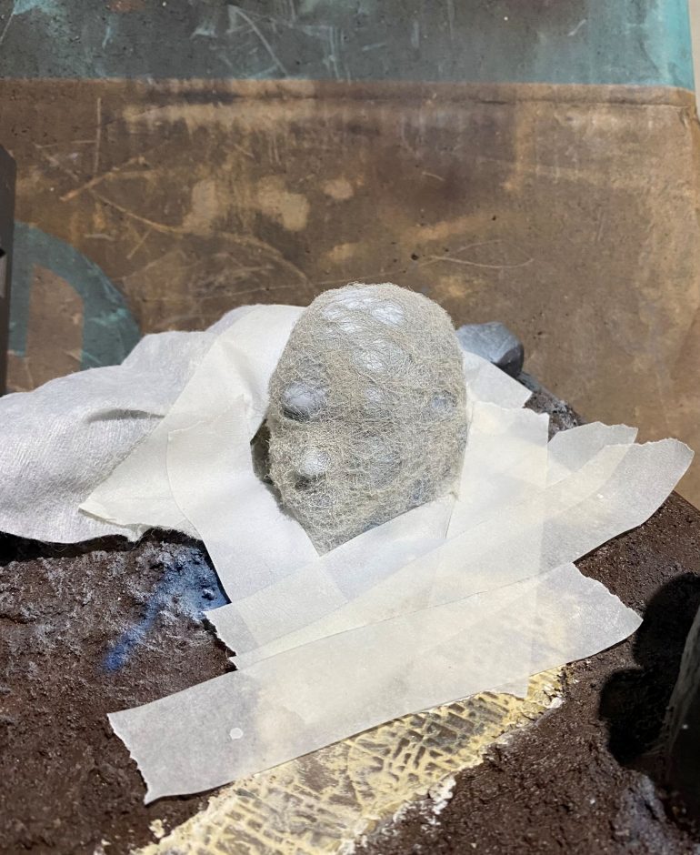 I then used a cheap airbrush to apply some off white followed by some white to the statue.  I concentrated most of the white to the top of the model.