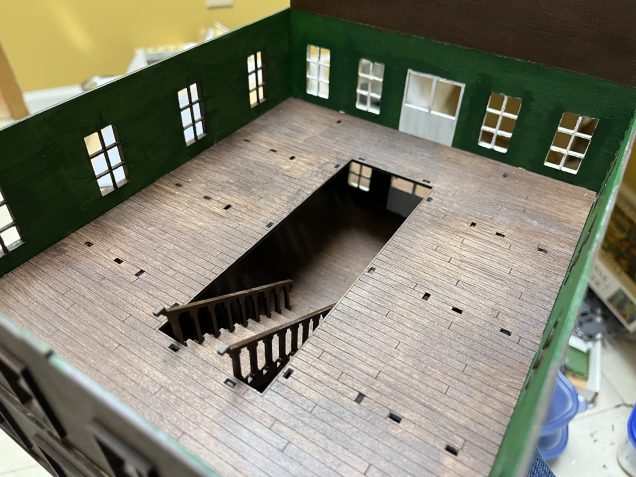 Partially assembled upper floor showing the relation of the stairs to the upper floor.  