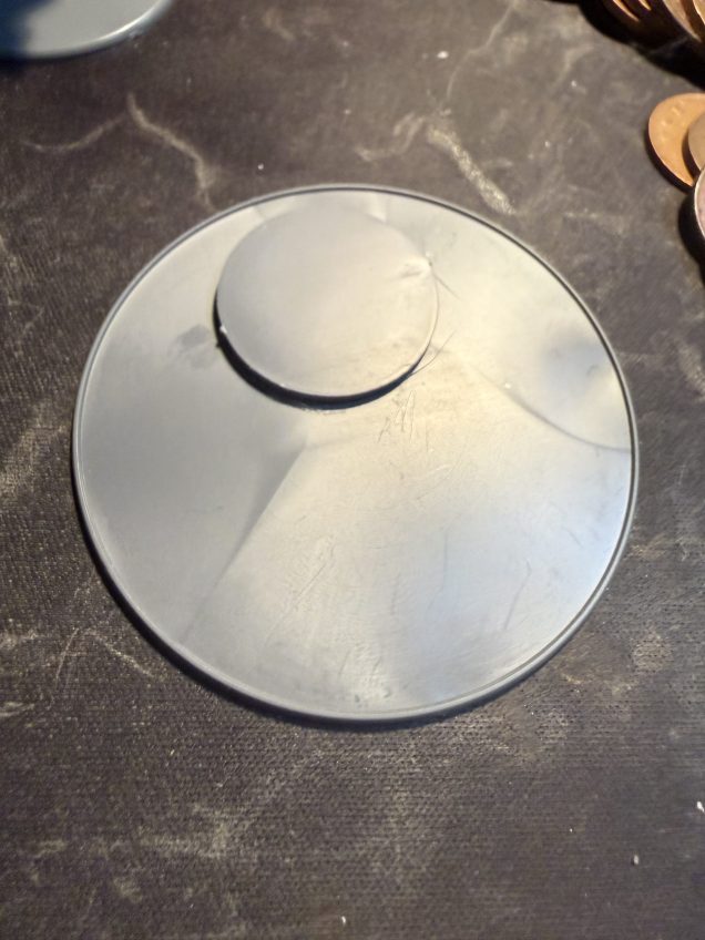 I taped a Star/frostgrave base to the larger base. These are good for the flat side wall but any base of the correct size will do.