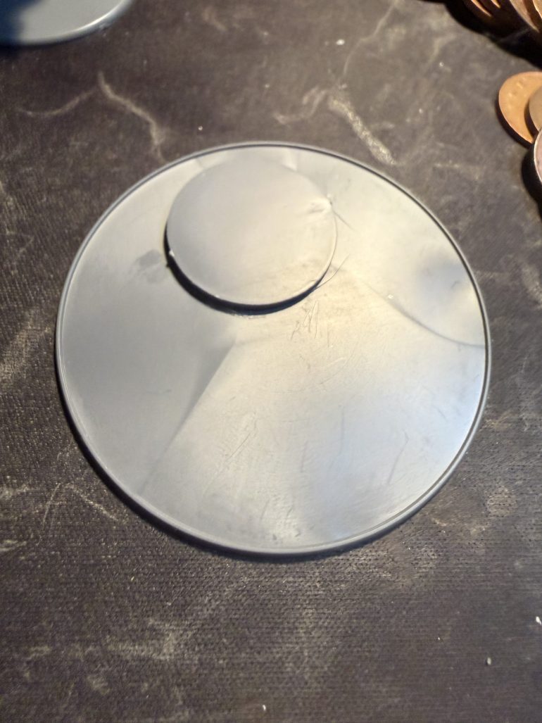 I taped a Star/frostgrave base to the larger base. These are good for the flat side wall but any base of the correct size will do.