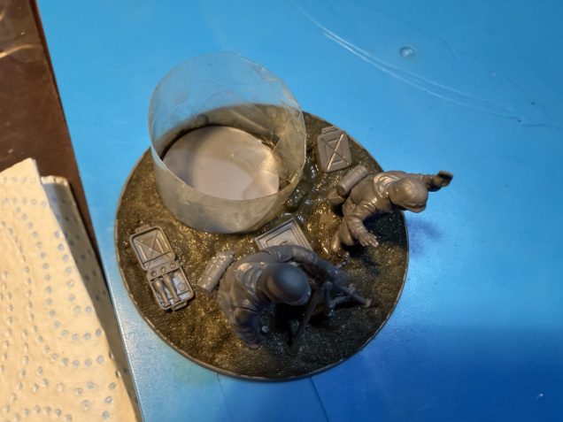 Built up the paste around the plastic barrier to ensure it will hide the slotted-in base