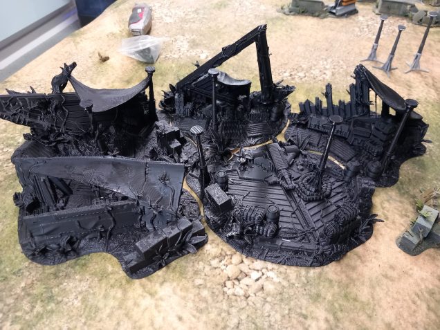 A collection of prints by david sheff models that when together create a large jungle camp. The pieces resemble a tie Fighter style craft and can be used as smaller pieces or one large camp