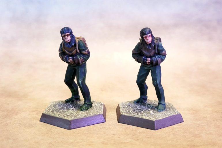 The main miniatures set included two copies of the same chimpanzee miniature, so as an experiment I decided to try painting them using two different techniques. The one on the left was done entirely using speedpaints, with just a bit of touch-up here and there and some drybrushed highlights. For the one on the right I went full Dallimore, building up through color triads and avoiding using any washes or similar tricks (although I did drybrush some highlights, just so all the models would have a more-or-less consistent look.