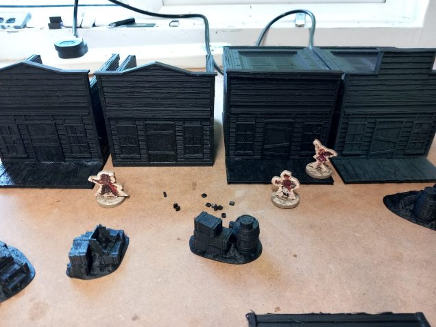 The  western buildings are generic enough to work with historical but the roof sections give them away as prefabricated park pieces. I've tried to recreate the schemes of the two buildings you can put together with the  card starter set