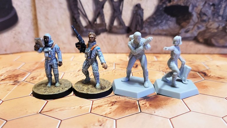 The painted ones here are both Crooked Dice. I think the scale lines up pretty well, and anyway there's only one astronaut character in the RPG campaign, plus an NPC who only features in the first chapter of the campaign.
