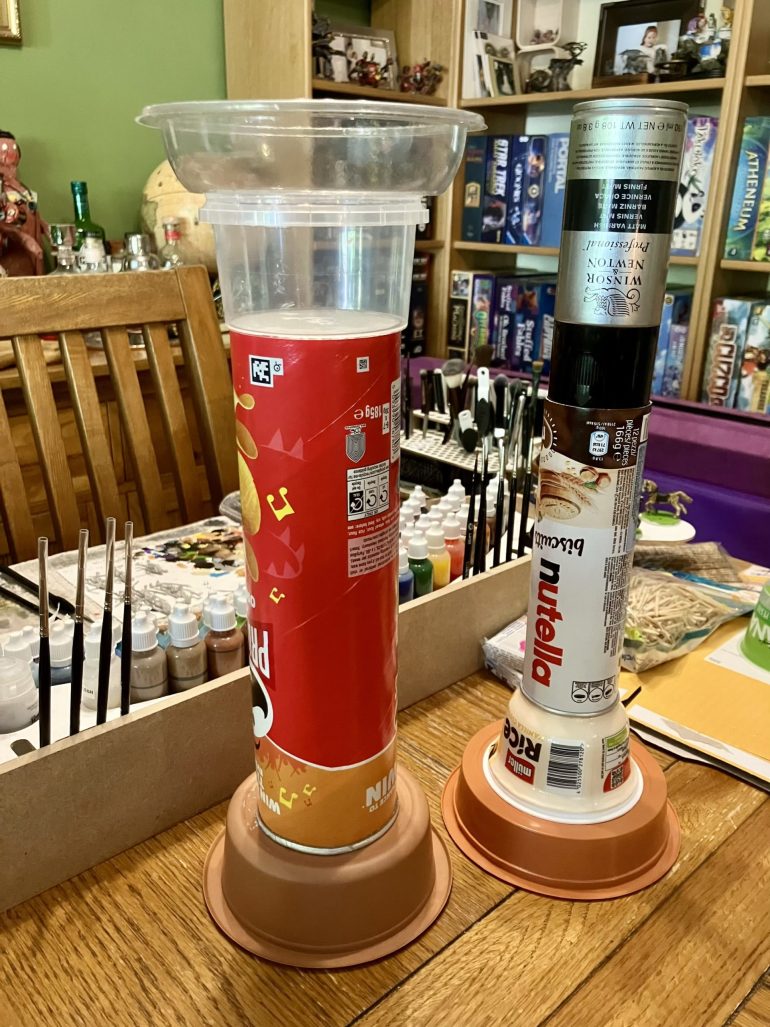 Stacked junk, the varnish can is just to weigh things down while glue dries