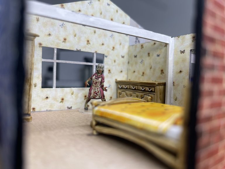 Glynis is trying to tidy up the room... only she can't remember how to