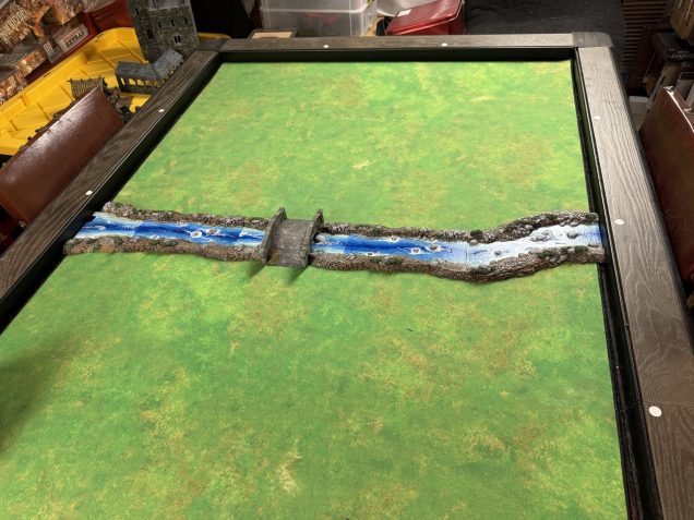 The river crosses the map on the second 'row' of the grid.