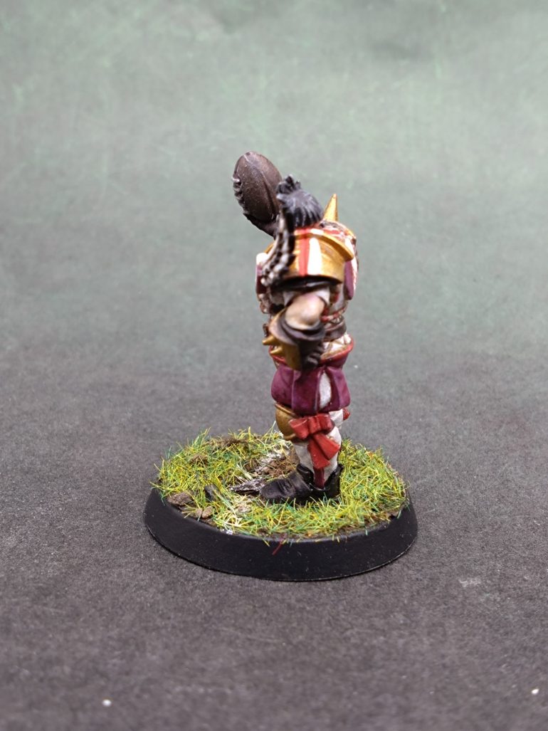 Want red and white stripes to be the accent colours to add some sporting feel to what could just be seen as golden armour of warriors rather than sportsmen.