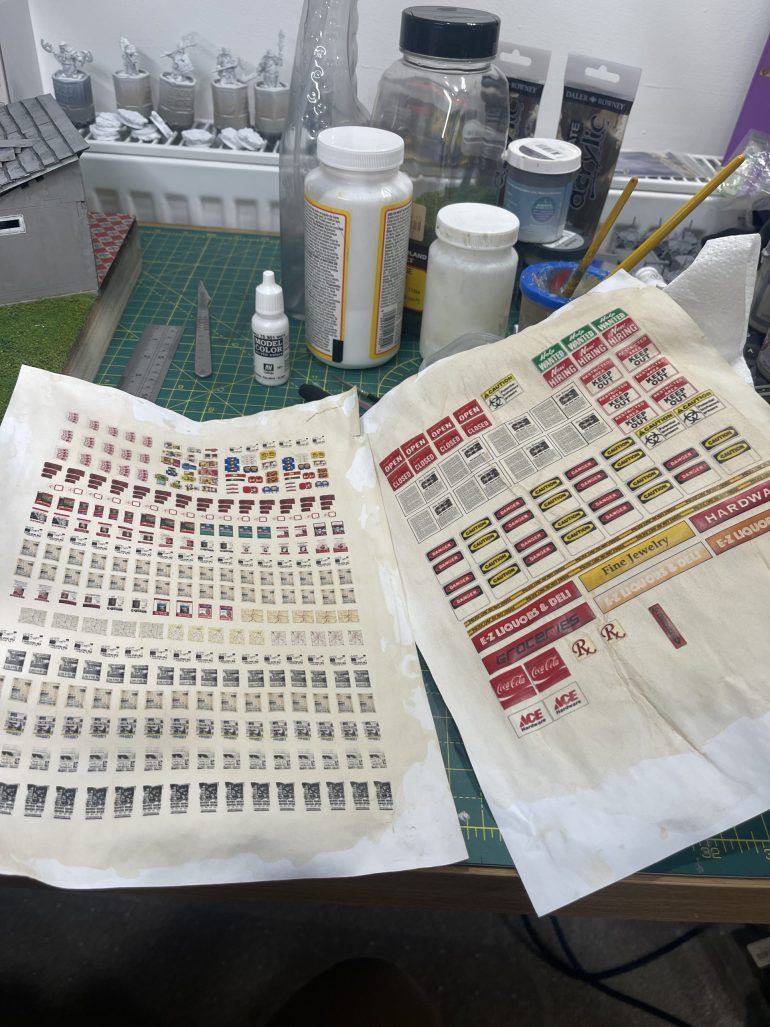 print of sheets of walking dead related posters. tea stain the paper (used tea bag-no milk and wipe it over the page)