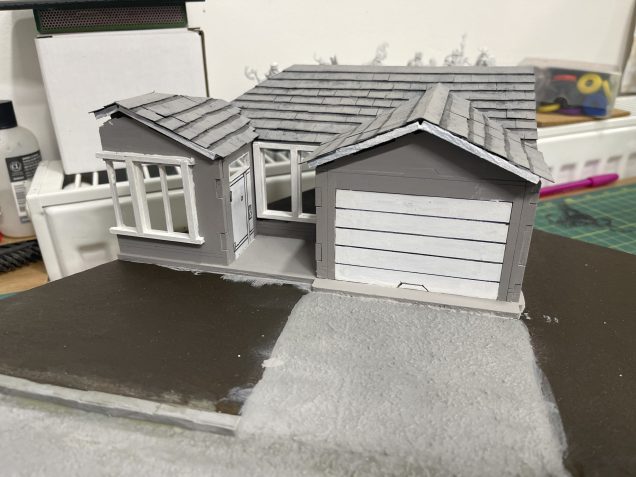 I used a permanent marker CD/DVD pen to draw on the lines of the garage and the blue woodwork