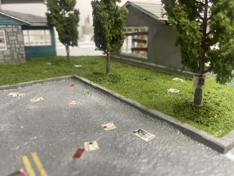 put a couple of missing posters on the trees as if they had been nailed there.