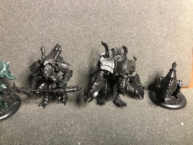 Here is the beginning of the small force. There is Lord Exhumator Scaverous, his Helljack Erebus, and a Defiler to start the battlegroup.