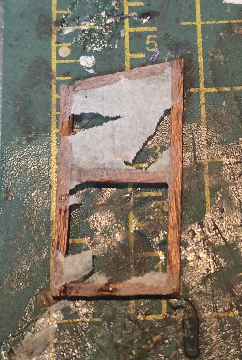 Removing the cigarette paper from wood frame. It was at this point I realised this method would be fantastic to create internal japanese screens, just leave paper on and for damaged version see photo....