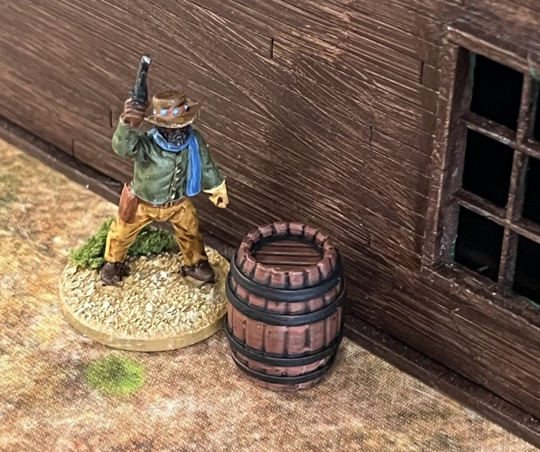 Ned Logan defends the cowboys sole barrel.