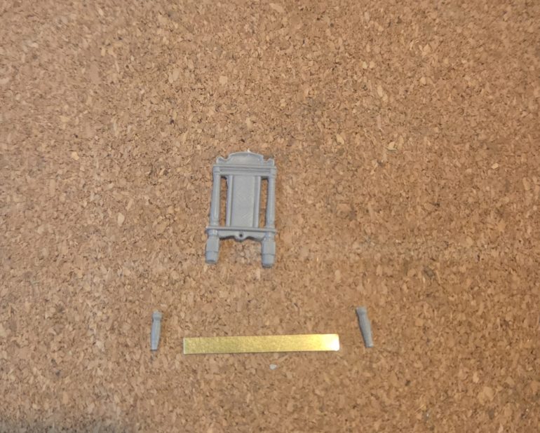 For the saw I used a piece of photo etch sprue, to my mind it does not matter that one edge is not serrated as the piece will always be viewed from above and will not be noticed. The handles are two chair legs trimmed down, and then superglued together.