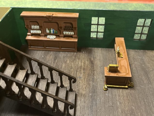 Something like this I think. I’m currently debating whether to glue these in place. But the bar area has access to one of the store rooms and that storeroom has an exterior door so seems logical.  