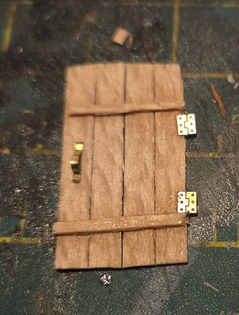 The door, again using etched brass bits for the door furniture.