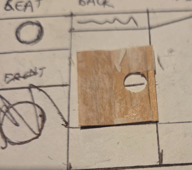 To make the toilet I stuck planks to a cigarette paper, let it dry, and used a hole punch for a perfect round hole.