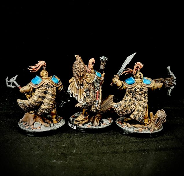 Rear view showing animal fur cloaks