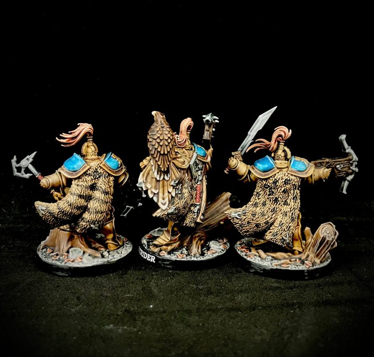 Rear view showing animal fur cloaks