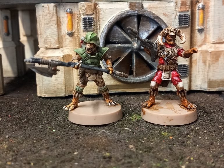 The unreliable merchant crusier the Exuberant Weasel is captained by Trandoshan Kruger ka. Kruger was raised in Trandoshan traditions until one prey he stalked escaped after killing his brother. Now he travels the outer rim in search of his grey and revenge. His first mate fellow Trandoshan krig joined the crew after his colony world was taken over by the empire. As a petty criminal he didn't get on with the empires rules. He carried a blade he's modified with a shock attachment to stun his prey.