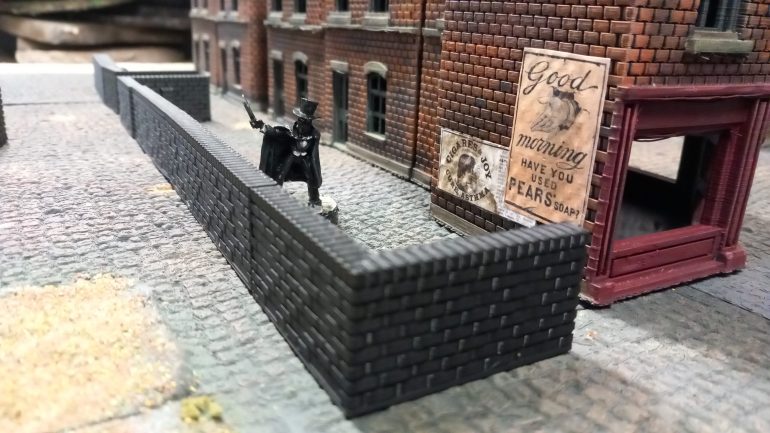 A friend of mine created some 3D files for walls and pavements which I printed to add to my table. The walls needed changing in s ale so the bricks matched my buildings. It's allowed me to add some back yards