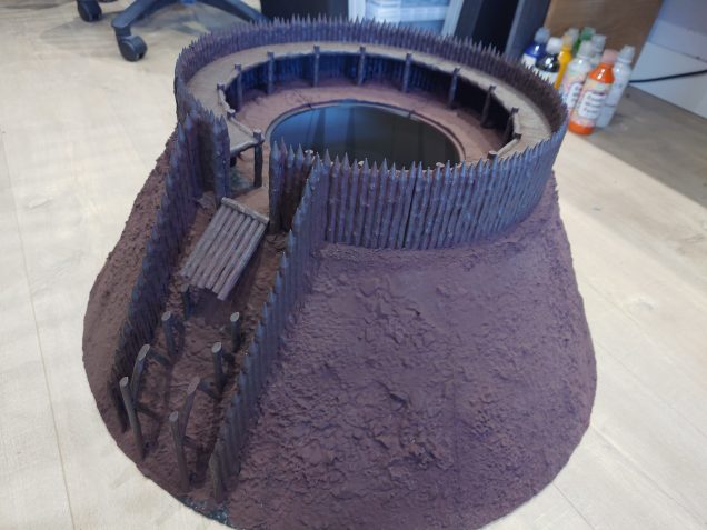 The painted pallisades dry brushed with lighter shades of brown lightened with a neutral gray the final highlight a dry brush of neutral gray. 