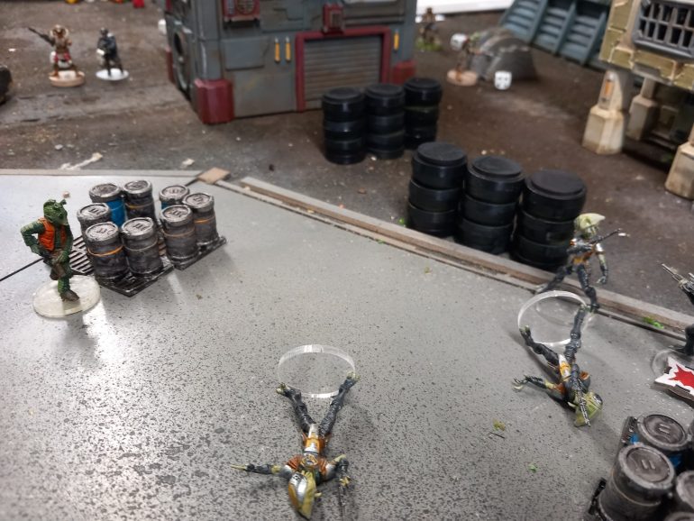 Weedos bold advance allows him to out flank the scum whose cover is no longer any use. With his close range hand gun he draws on the foe.