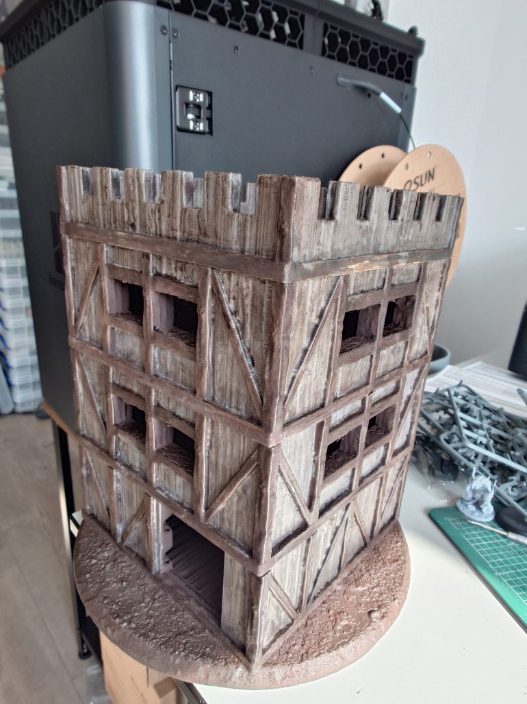 After some serious dry brushing, some use of some thinned grey speed paints and some strong tone I have reached this stage on the tower.