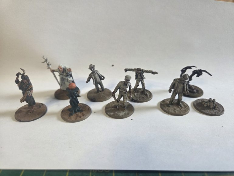 From L to R: a Crooked Dice witch, a Reaper witch, 3 Harwood Hobbies and 1 Copplestone zombie to represent Husks. As well as three tokens that can denote Minor Mythos locations.