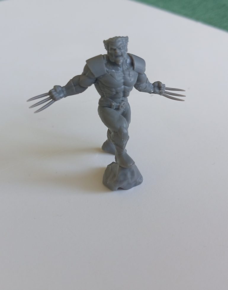 Wolverine. I have a lingering memory of him from the Days of Future Past comic book. A sentinel blasts him with some kind of energy and all that remains is his adamantium skeleton...