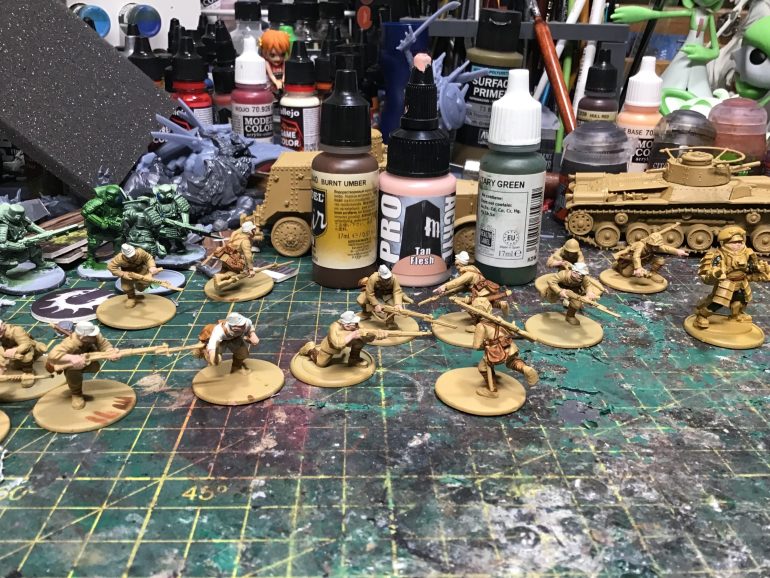 Painted the skins in tan flash from pro-acryl, probably should have use sunny skin tone. Use burnt umber for belt and leather. And military green inner suit for exosuit japan