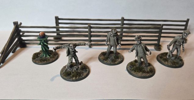 The 4 Husks I had originally drybrushed in the ghostly greeny grey with the intention of speed painting. I had already applied GW Gulliman Flesh Contrast paint to their flesh. Having recently seen the official models, I realised they were more of a spirit creature. So I just highlighted the skin up with pale fleshes tinted with olive green. The separately painted faces and hands gives the figures a nice focus. A quick easy fix. I also painted up a Reaper Bones orb on plinth, the orb was painted TTC Fanatic Orange and then from the bottom up I built up purple blending into turquoise into the orange. I highlighted the orange adding Yellow and while, creating an electric effect. The plinth was painted TTC Emerald Green  washed in AP Grim Dark Shadow, highlighted with the Emerald Green, with two further highlights adding yellow and white to the green. Drybrusjed a couple of fences.