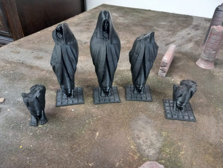 To help with stability I merged the statues with some room tiles I've been working on. I shrank them down and now my prints work 